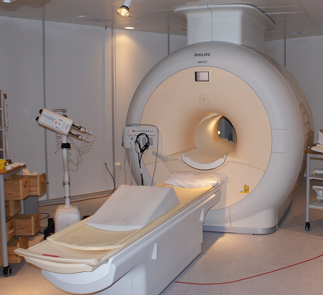 MRI scanner and patient table in an imaging room