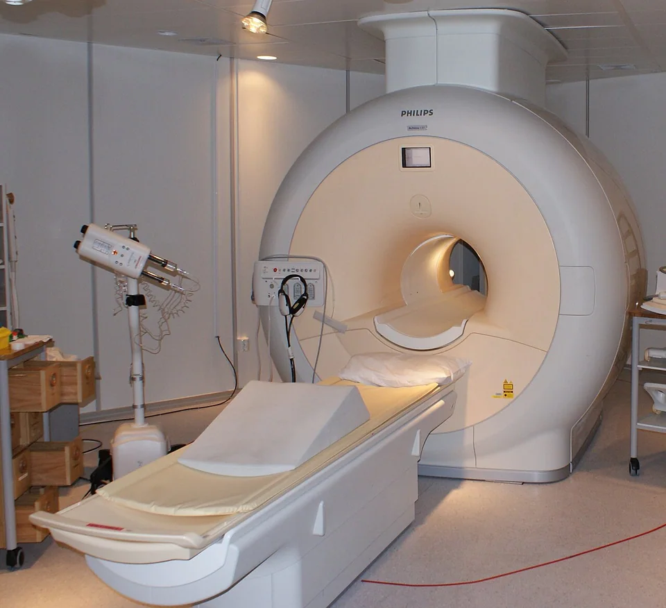 MRI scanner and patient table in an imaging room