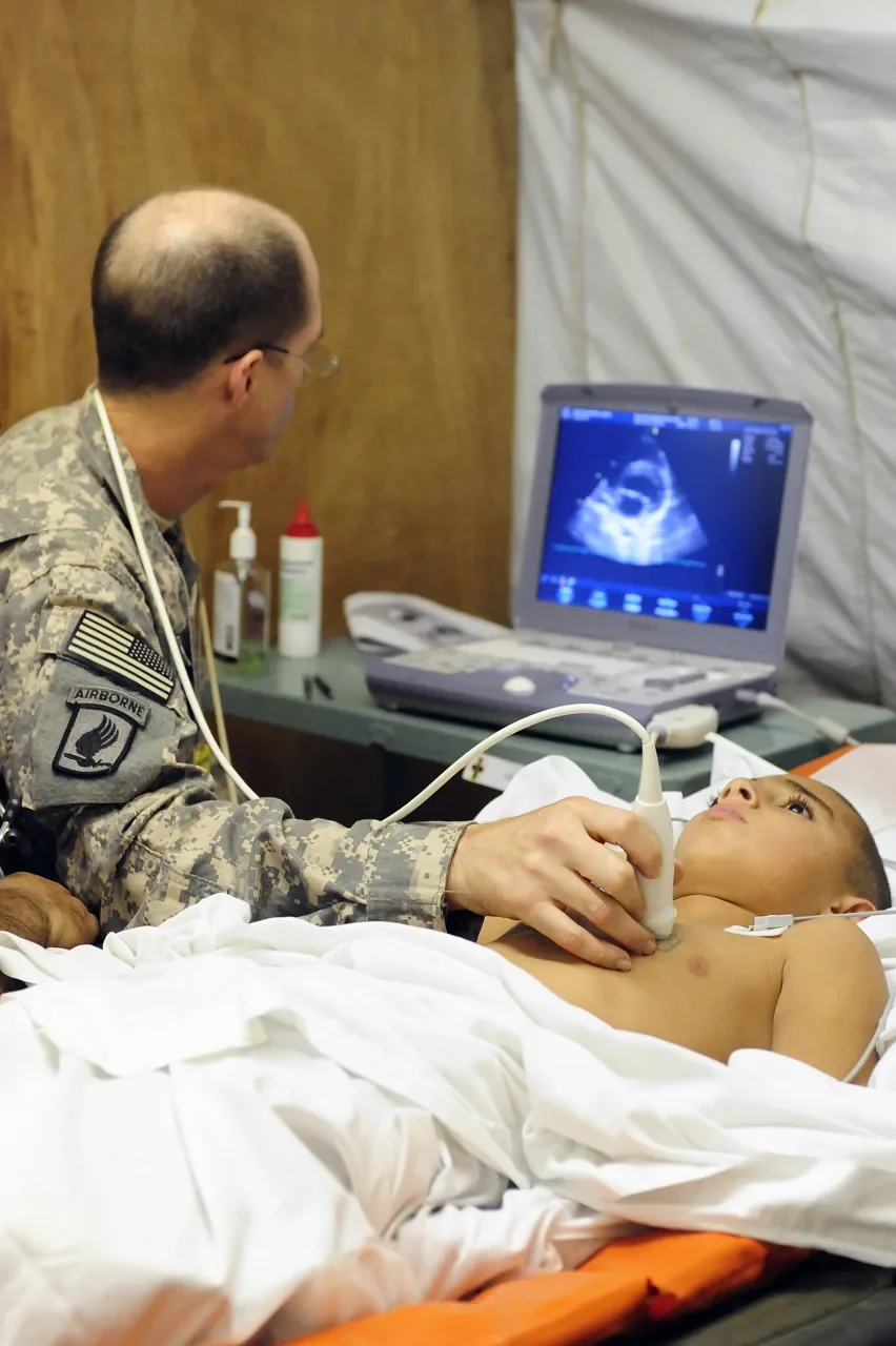 A pediatric echocardiography examination in Iraq, photographed in September 2009. Archive clinical setting.