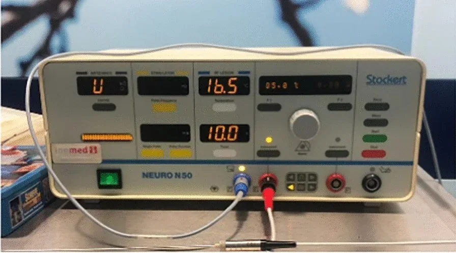 An Inomed Neuro N50 radiofrequency generator with its front panel, display and connected leads.